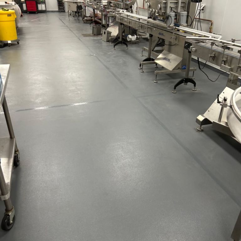 Slip-resistant commercial kitchen epoxy flooring installation in a New Jersey restaurant.