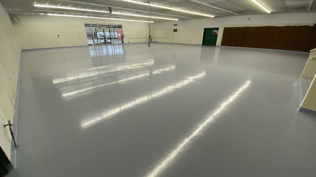 USDA-compliant industrial epoxy flooring for a food processing facility in Newark, featuring high-gloss seamless coatings.