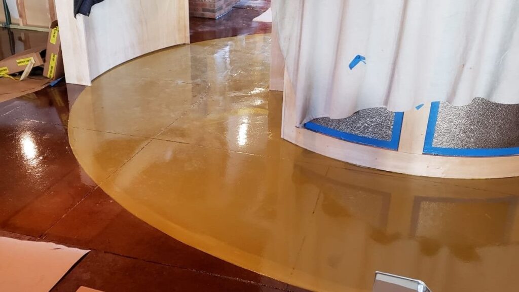 Seamless high-gloss decorative restaurant epoxy flooring installed in a commercial dining and bar area in Central Jersey.