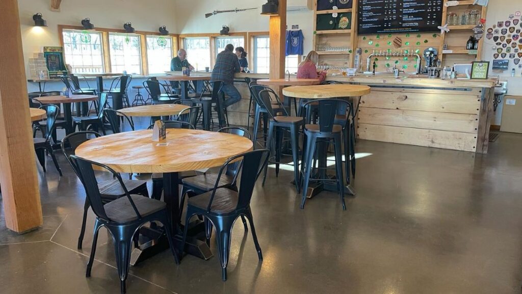 Decorative commercial restaurant flooring installed in a rustic Hudson Valley dining room and bar area.